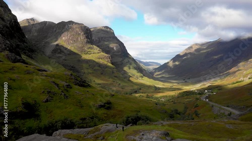 Scenic drone view of a road winding through highlands in Scotland near Glencoe