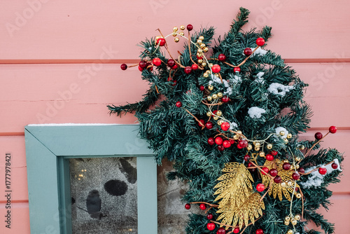 Christmas tree and New Year decorations on the town square on a frosty winter day.