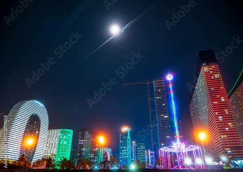 Batumi city skyline with neon lights, modern skyscrapers, smart city vibes and futuristic architecture reflecting nightlife, tourism, travel and urban innovation in Georgia