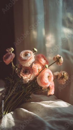 Beautiful Bouquet of Ranunculus Flowers Softly Lit in a Cozy Indoor Setting