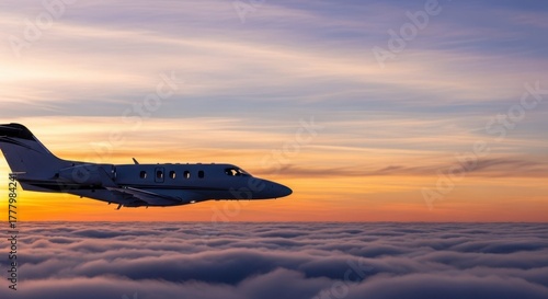 Wallpaper Mural Silhouetted private jet above sunset-tinted clouds, tranquil high-altitude flight with gradient sky backdrop Torontodigital.ca