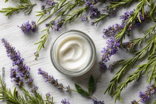 Lavender Cream Surrounded by Fresh Lavender and Rosemary on a Wooden Surface