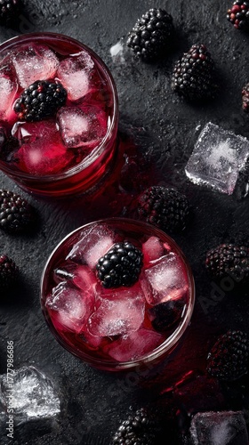 Refreshing Blackberry Drinks With Ice on a Dark Stone Surface