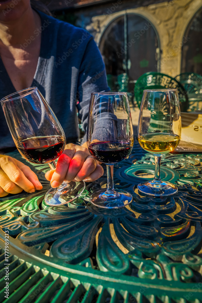 Fototapeta premium port wine testing, glasses with drink woman holding one