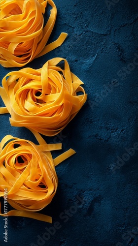 Freshly Prepared Fettuccine Pasta on a Dark Textured Surface