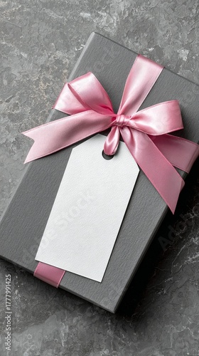 Beautiful Gray Gift Box With Pink Ribbon and Empty Tag Ready for Special Occa...