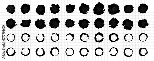 Abstract hand drawn grunge ink paint black circles on grid background