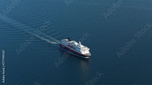 Hurtigruten ship seen from above in daylight, cruising Norwegian sea