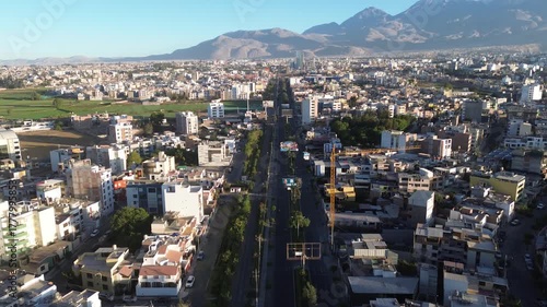 Aerial shot of Arequipa city, Peru, with the Chachani volcano in the background – panoramic drone view over the districts of Cerro Colorado and Yanahuara under a clear sky