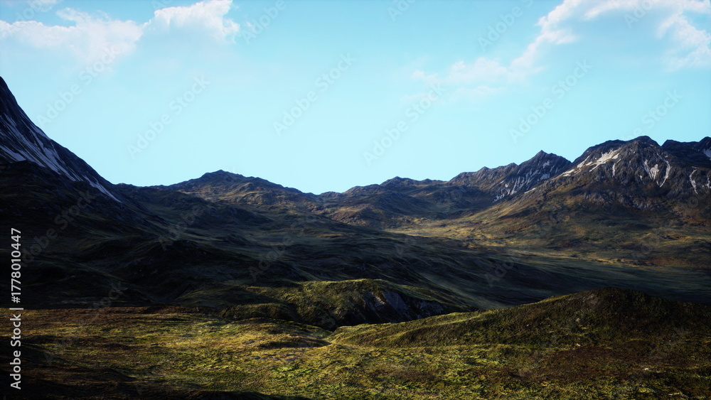 Obraz premium Rolling hills and majestic peaks stretch across the landscape, bathed in warm sunlight. The bright blue sky enhances the vibrant colors of the terrain, creating a peaceful scene of nature.