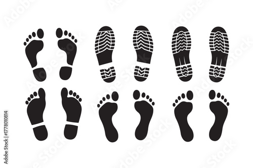 Collection of black footprints and shoe prints on white background