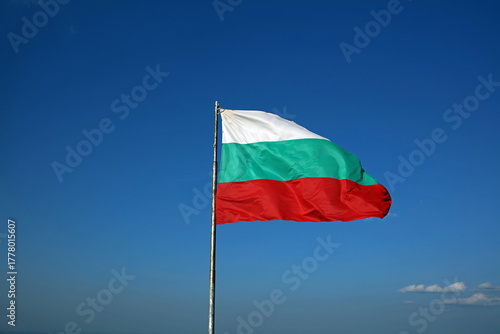 Bulgarian flag in the wind against a blue sky
