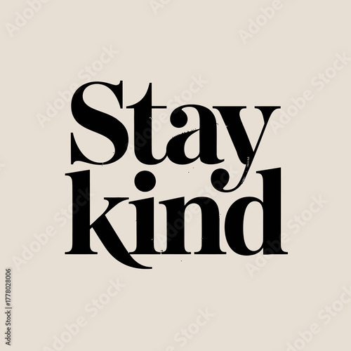 Inspirational typographic quote stay kind in bold black serif font on a soft beige background promoting positivity and empathy