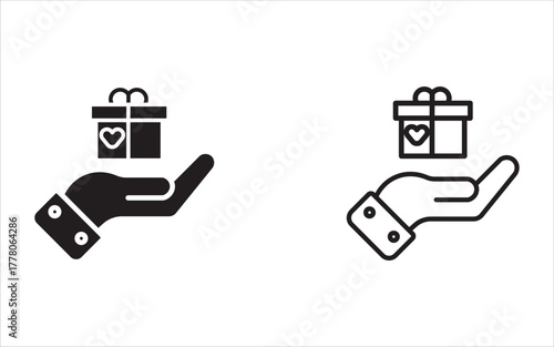 A hand holding a small gift box decorated with ribbons and heart symbols, symbolizing giving, generosity, donations, the concept of surprise, special gifts, and philanthropic gestures.