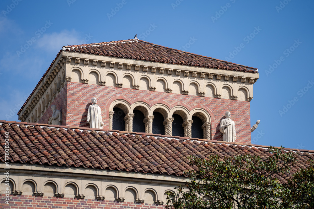 Obraz premium Romanesque brick building with arches and tile roof