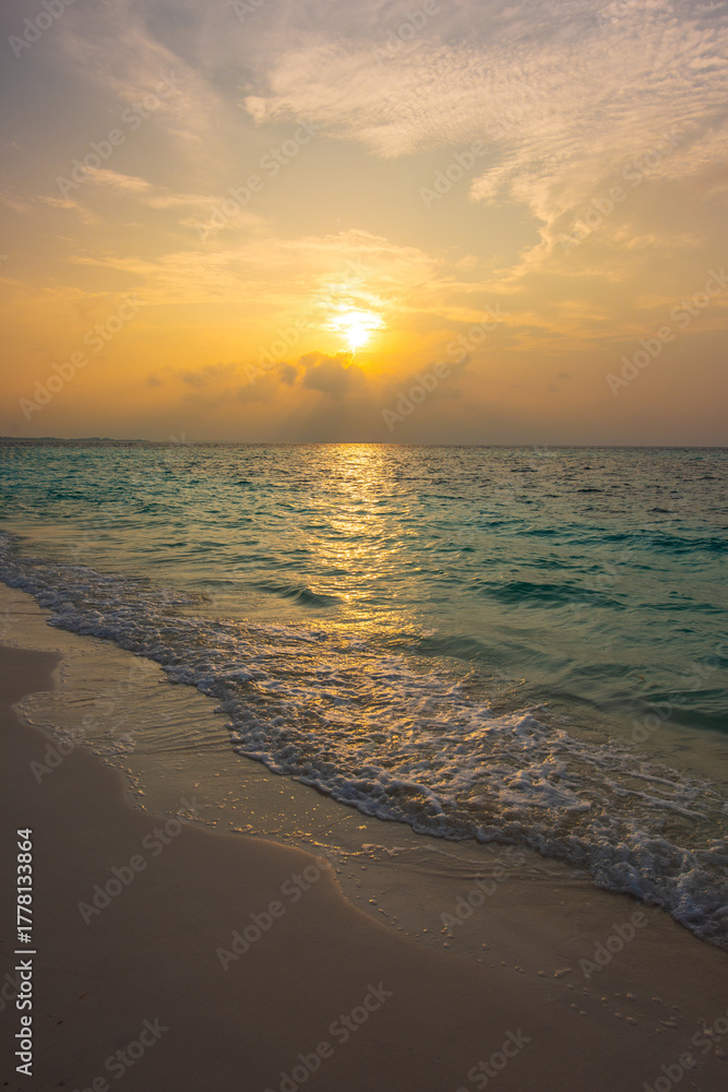 Fototapeta premium Tranquil closeup calm sea water waves with palm trees. Beautiful sunset panorama. Tropical island beach landscape exotic shore coast. Summer vacation, holiday amazing nature. Relax paradise, Maldives.