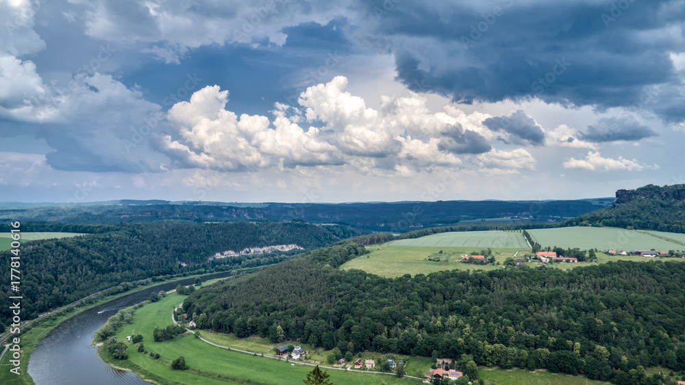 Fototapeta premium View from the Fortress Königstein overlooking the Elbe River and the Lilienstein, with wide landscape and elevated perspective.