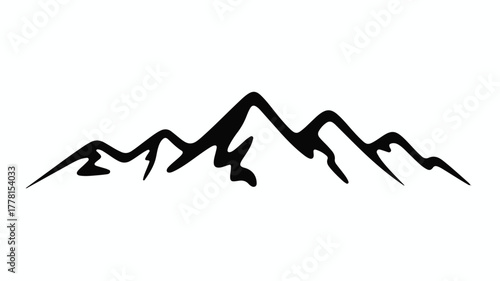 Majestic mountain range silhouette against a bright, clear sky.