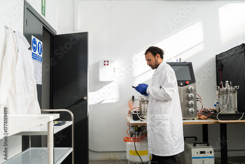 Wallpaper Mural  scientist researcher working on biotech laboratory Torontodigital.ca