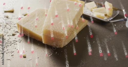 Red white binary code overlay cascading then hand grating Parmesan slabs for digital cooking demo
