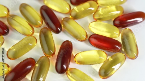 capsules mix softgel of food supplements, fish oil, omega 3, vitamin E, oval gelatin capsules