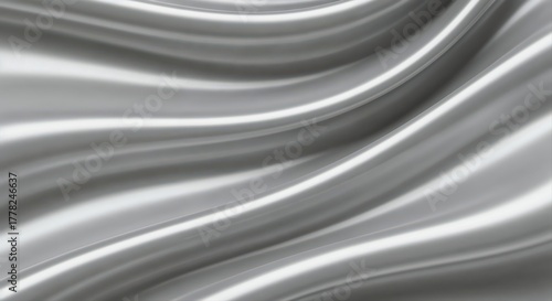 Shining Silk: Capturing the elegance of a silver fabric, the image showcases the fluid, lustrous folds and subtle highlights of the material, evoking a sense of luxury and sophistication.