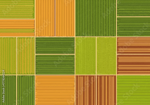 Aerial view of a patchwork field grid with varied crops and tilled earth