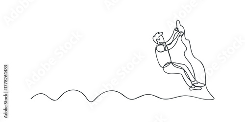 Man climbing rocky mountain face single line