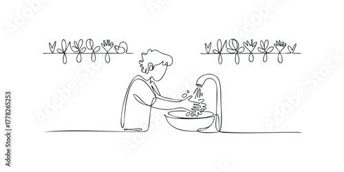 Person washing hands under running water in sink