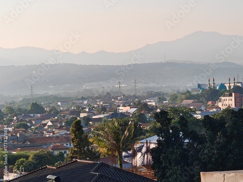 Peaceful Cityscape with Distant Mountains