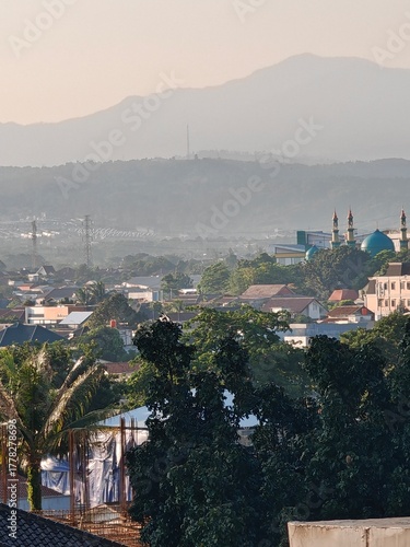 Peaceful Cityscape with Distant Mountains