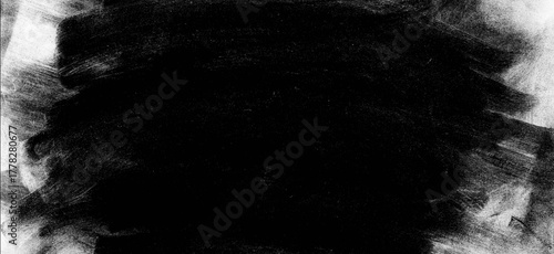 Abstract black brush stroke with a rough and textured edge, creating a bold and dramatic effect, perfect for adding depth and contrast