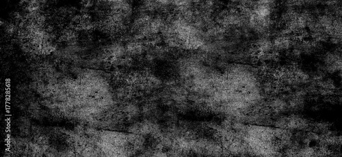 Dark monochrome abstract texture with dense brush strokes and splatters, ideal for creating a gritty and atmospheric background or overlay effect