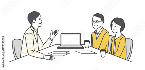 窓口でお客様の接客をするビジネスパーソン