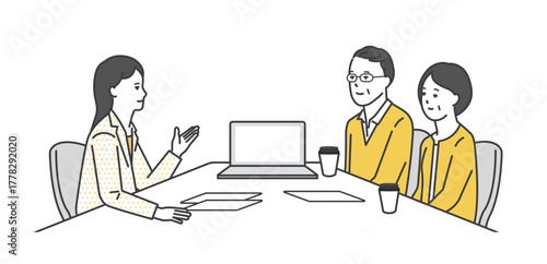 窓口でお客様の接客をするビジネスパーソン