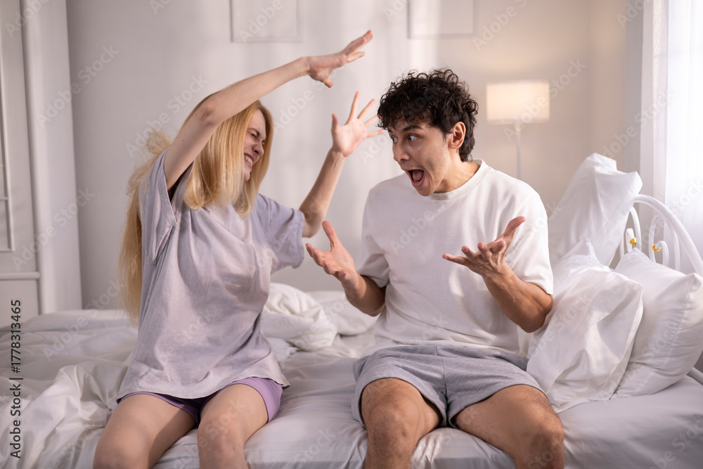 Fototapeta premium Couples who are angry at each other, fighting in bed, feeling frustrated, sad, divorce or relationship problems, marital stress, quarrels and arguments, unhappy spouses, and sexual dysfunction.