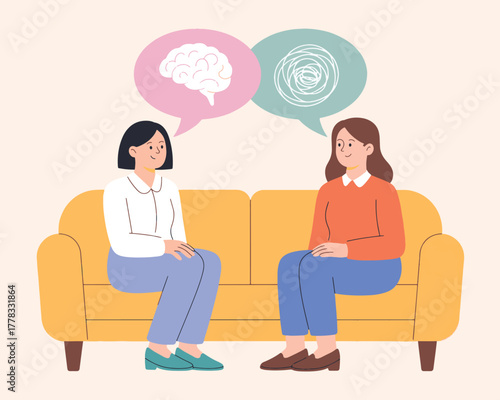 Mental Health Therapy Session with Two Women on a Couch Discussing Feelings