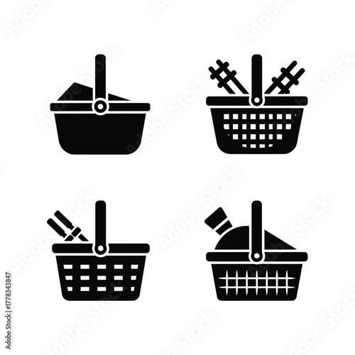 Collection of black silhouette icons representing picnic baskets filled with various items such as food, utensils, and bottles
