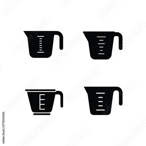 Collection of Measuring Cups with Metric and Imperial Measurements for Kitchen and Baking Needs