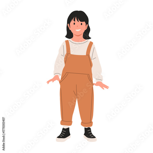 Smiling little girl wearing brown overalls and white long-sleeve shirt, standing with cheerful expression. Cute child character illustration, isolated on white background, flat vector style.