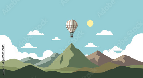 Hot Air Balloon Ascending Over Majestic Mountain Range.