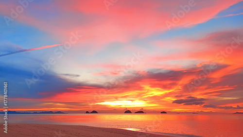 Sea sunset, tropical island beach sunrise, beautiful ocean panorama landscape, colorful red orange pink yellow sky clouds over water, golden sun light, summer holidays, travel