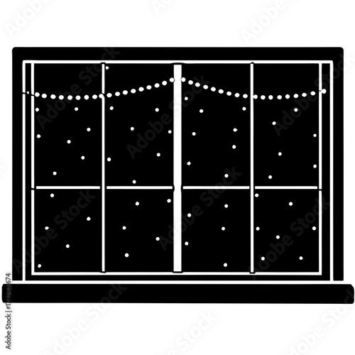 A window with a view of a snowy night and a string of lights