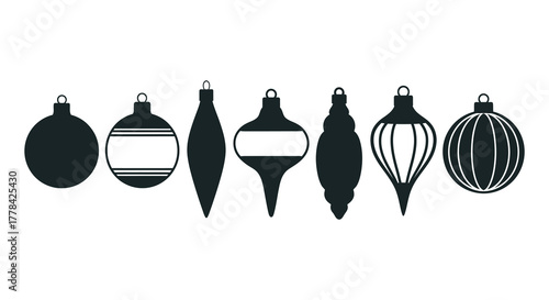 Collection of elegant black and white christmas ornaments in various shapes and sizes on a white background