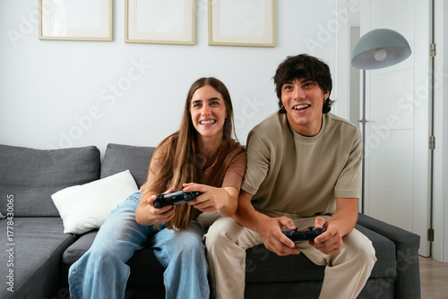 Happy Couple Playing Video Games Together at Home