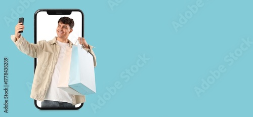 Young man with shopping bag...