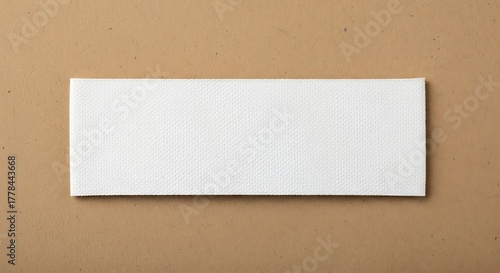 Clean White Paper Towel on Textured Brown Surface, Top View