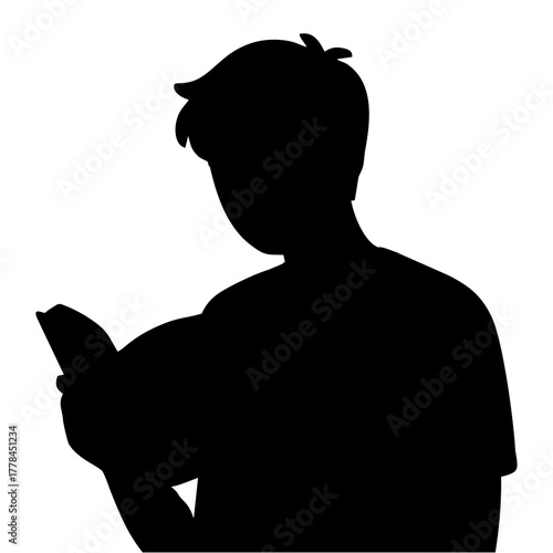 silhouette of a person reading a book
