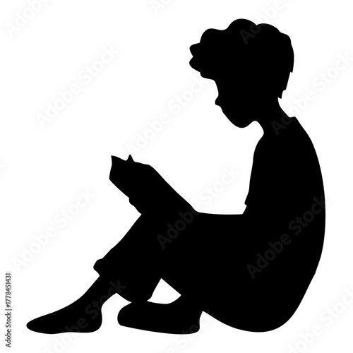 silhouette of a person reading a book