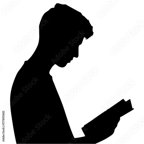silhouette of a person reading a book